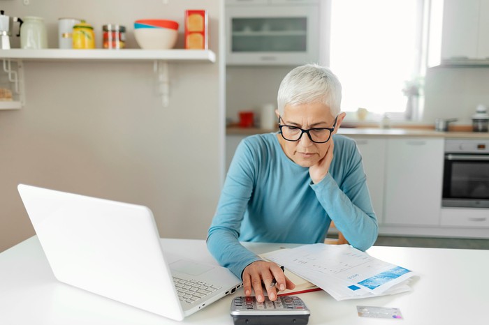 Older woman key on calculator