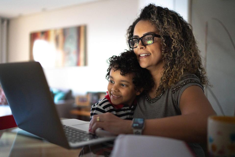 A mature woman who works at home and carries a young son.