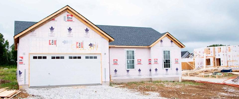 MOSCOW MILLS, MISSOURI - July 30, 2021: A nearly completed two-story newly built house in the master plan community is ready for siding and refurbishment during the branch of the building.